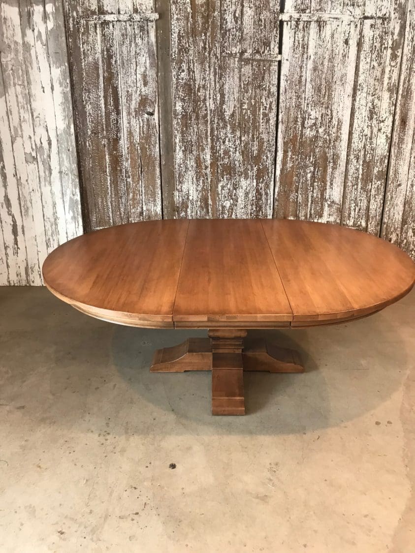 Single pedestal table with extension